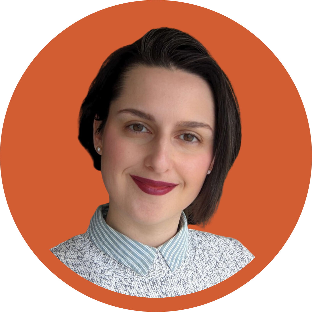 Woman with brown hair in orange circle.