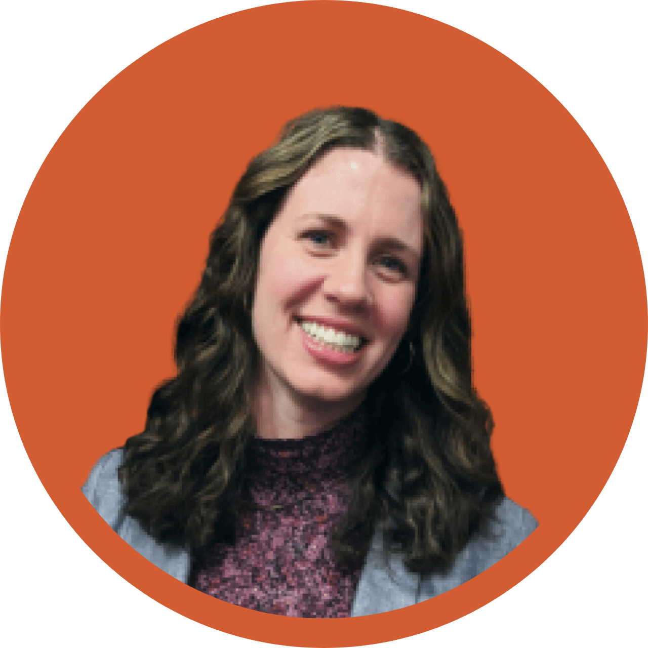 Woman with brown hair in orange circle