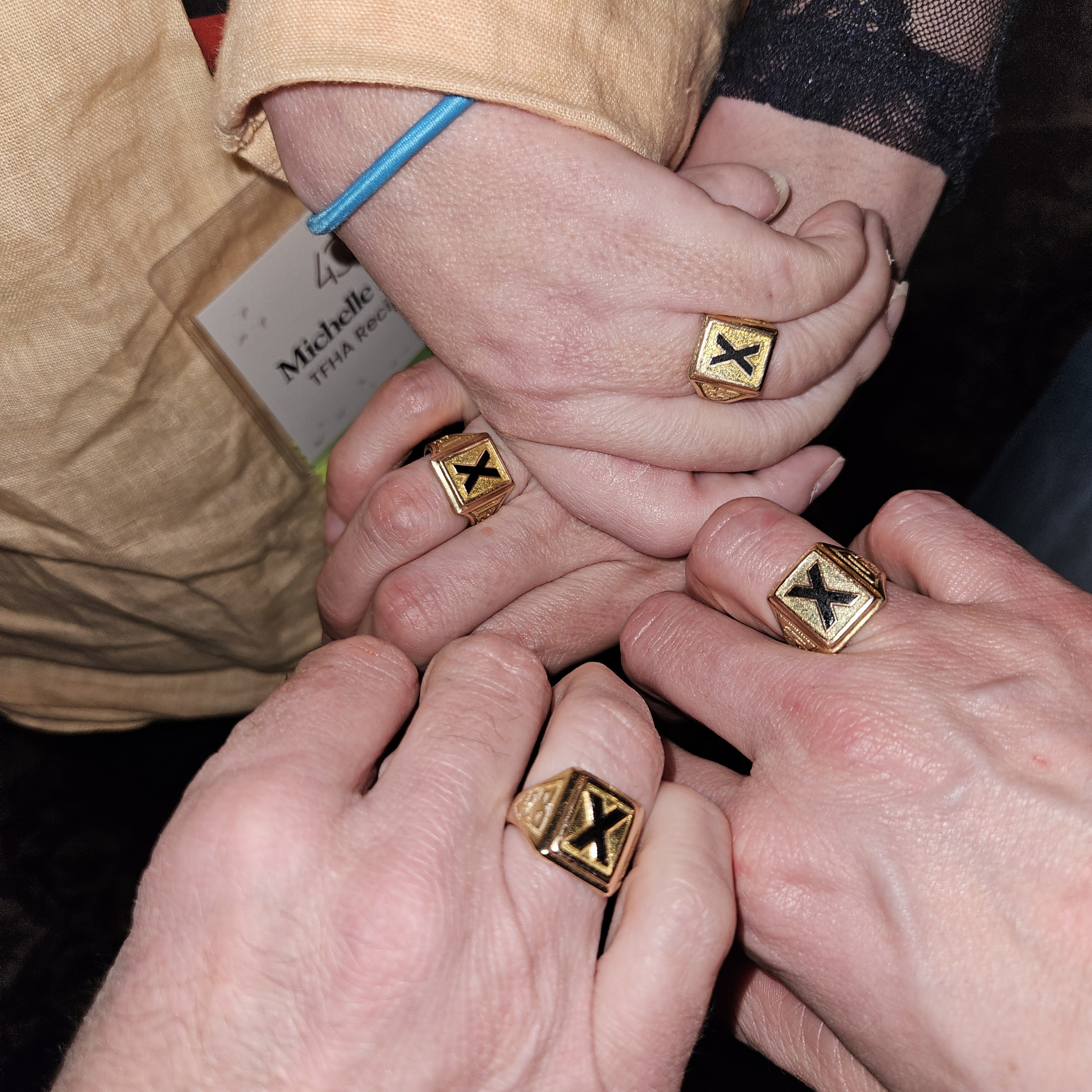 StFX alumni showing their X-Rings at the TFHA Alumni (Re)Connect Tour in 2025 StFX alumni showing their X-Rings at the TFHA Alumni (Re)Connect Tour in 2025