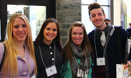 4 students wearing their event photocheck