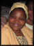 A woman wearing a yellow hat and smiling