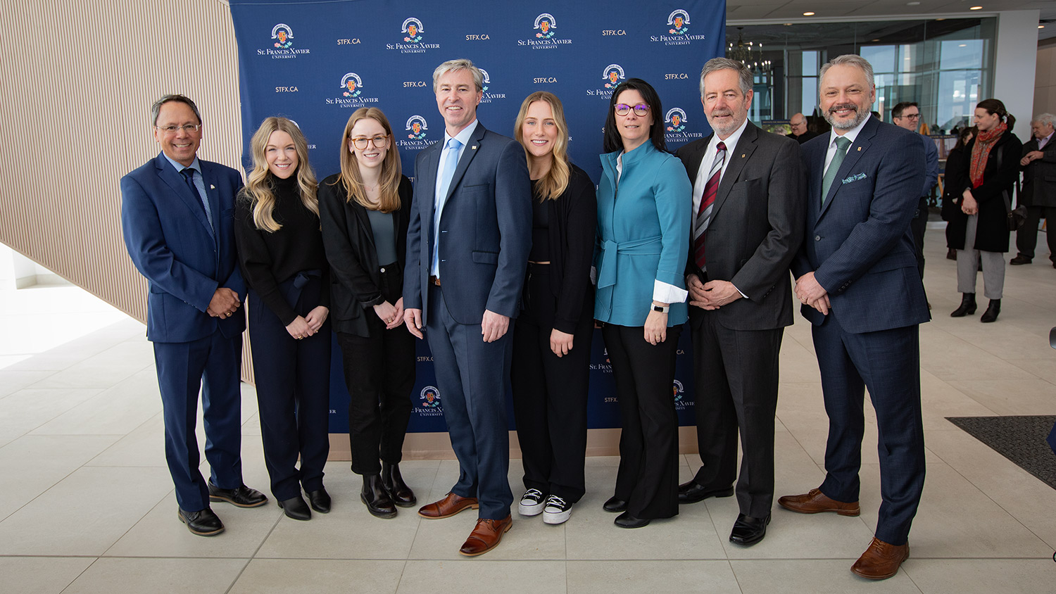 Group Photo after the Centre for Innovation in Health Funding Announcement A group photo of Michelle Thompson, Tim Houston, Andy Hakin, and others after the health funding accouncement..