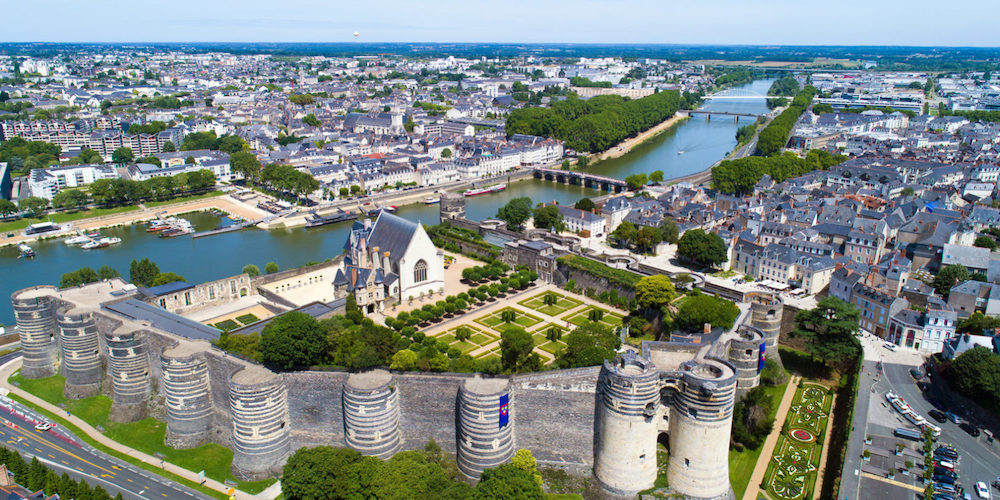 An aerial view of a city with a river running through it.