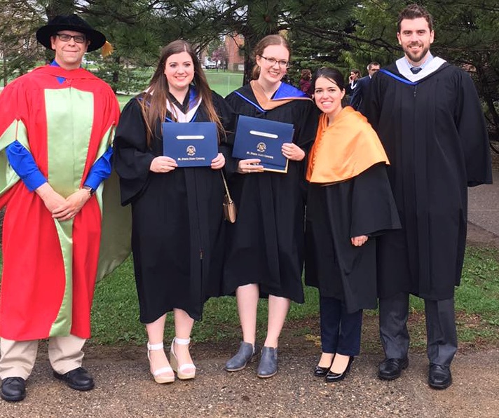 Students celebrating their graduation with their faculty on the convocation day.