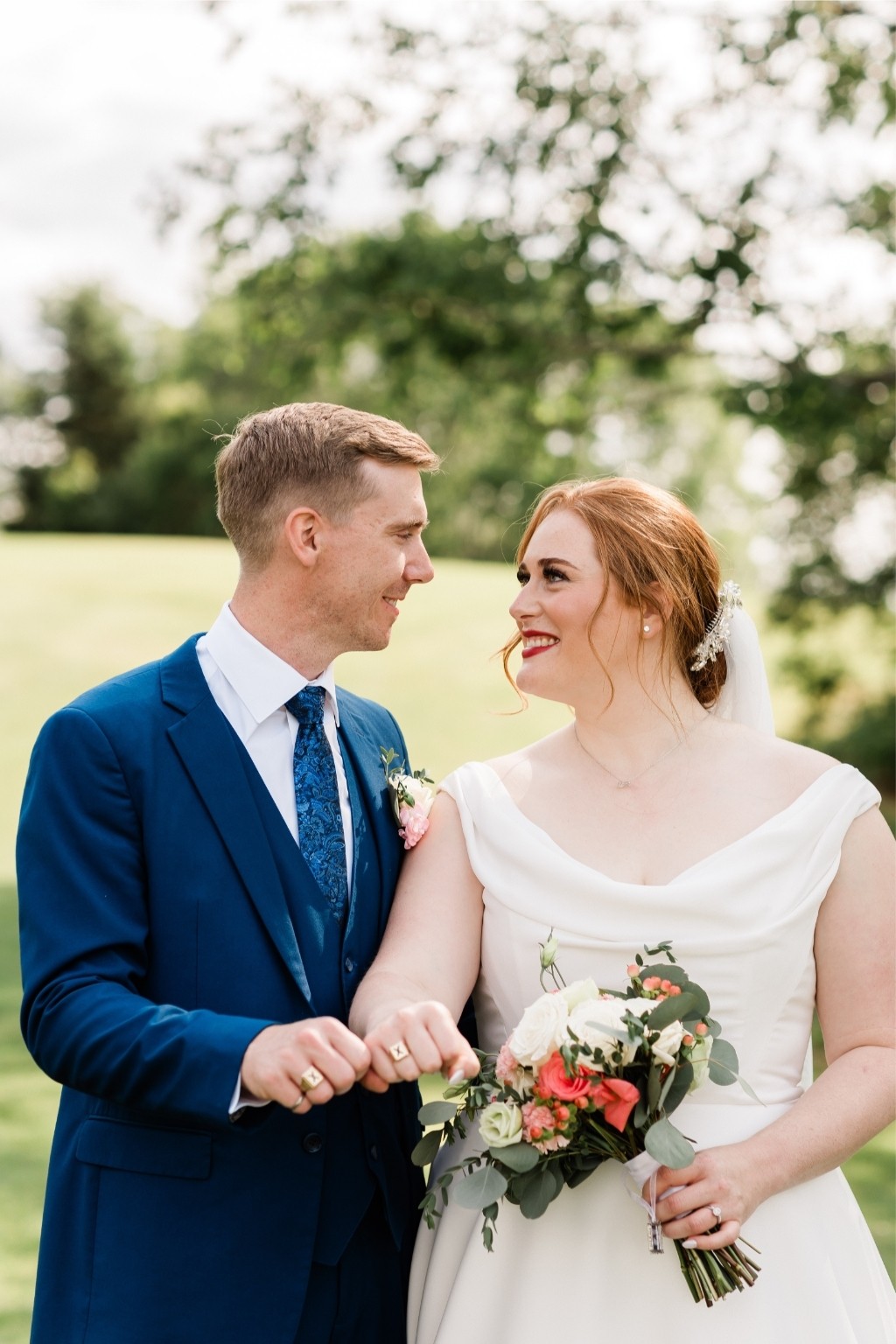 Smiling newlyweds in an outdoor setting