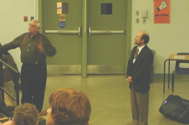 Faculty members teaching a lecture.