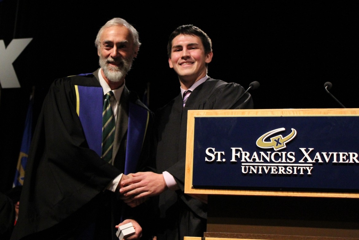 Dr. Steven Baldner is presented with the 2013 Honorary X-ring