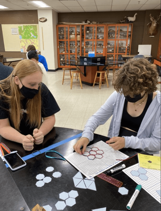 Students Making Hexagon Shapes With Scrapes of Paper