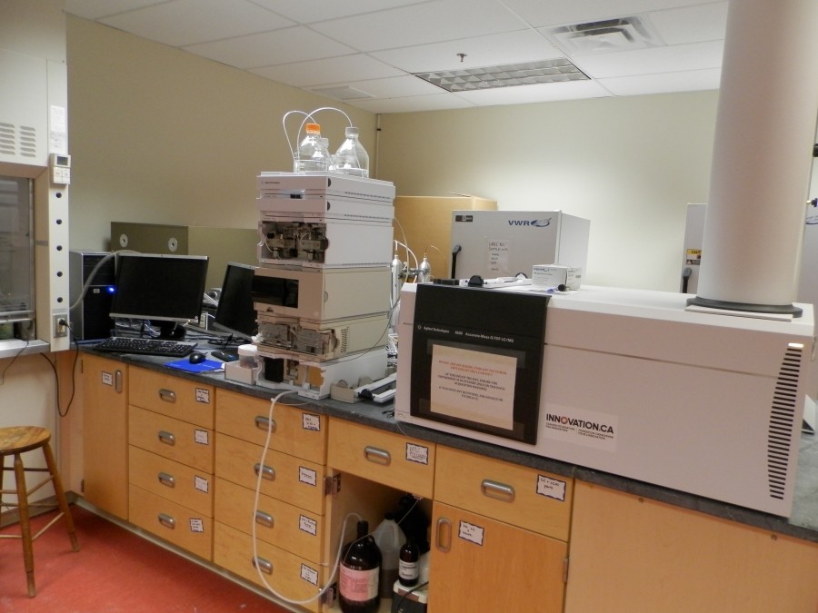 A computer and lab equipment on a counter