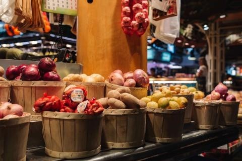 Small wooden barrels on a bench, full of vegetables