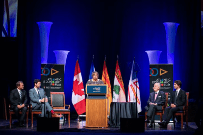 People sitting on stage during the Atlantic Economic Forum